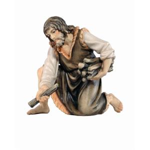 Pastore inginocchiato con legna