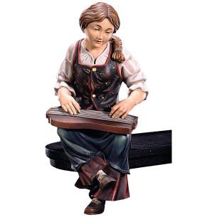 Zither player seated