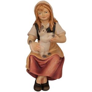 Bambina seduta con gatto