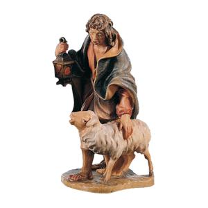 Shepherd with sheep and lantern