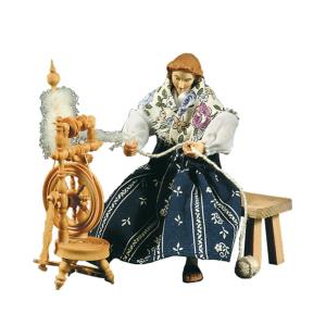 Spinning woman with spinning-wheel