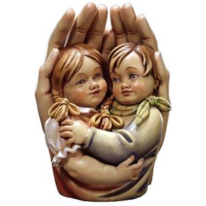 Protective hands with girl and boy