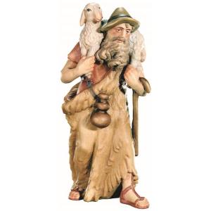 Pastore che cura le sue pecore