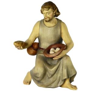 Shepherd kneeling with bread