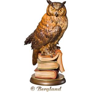 Owl on three books