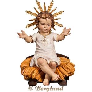 Jesus Child clothed "IHS" sitting with cradle