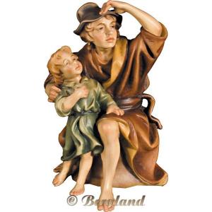 Pastore seduto con bambino