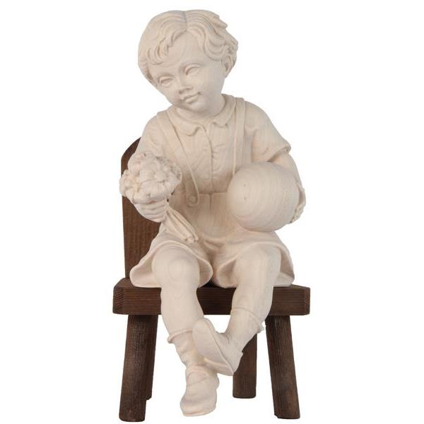 Sitting boy with ball on chair - natural